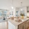 living room and kitchen area flooded with natural light