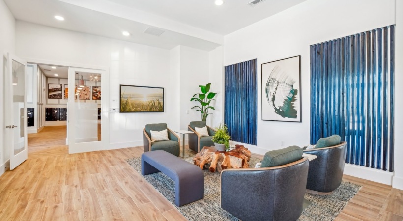 Your new home is waiting lobby seating area with chairs and a table