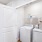 laundry cloest with shelving and a woven basket