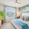 bedroom with teal accents and a art on the walls