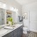 bathroom with a large mirror and two sinks